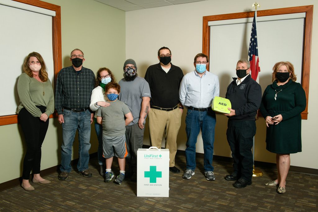 Middleton Township officials pose with representatives of local churches during presentation of donated defibrillator and first aid kit purchased with CARES Act funds